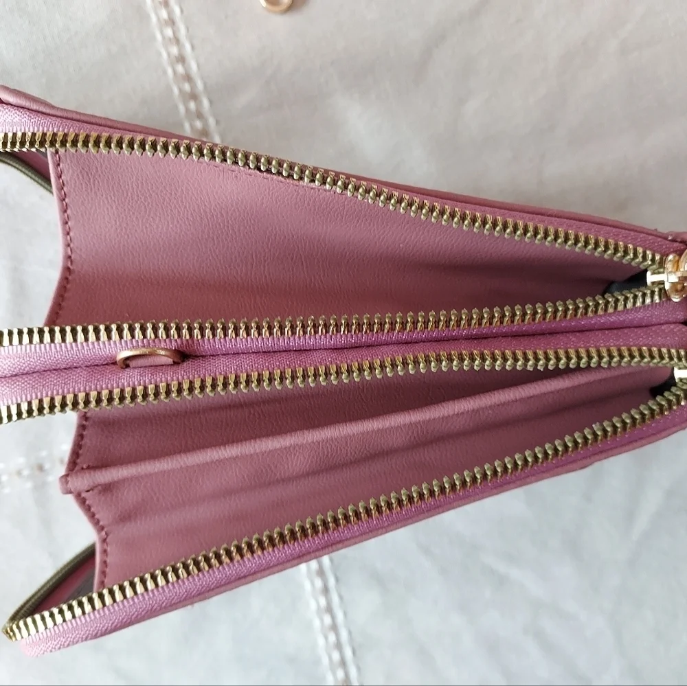 Roulens over shoulder or clutch wallet with cell phone holder.